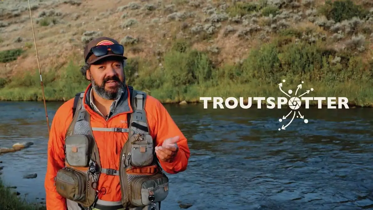 Josh Crumpton on a trout river explaining TroutSpotter for onWater
